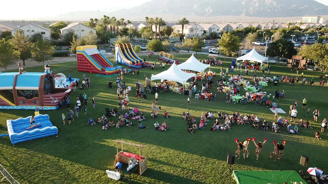 Outdoor company picnic with inflatables, tents, and tables header for Las Vegas event production