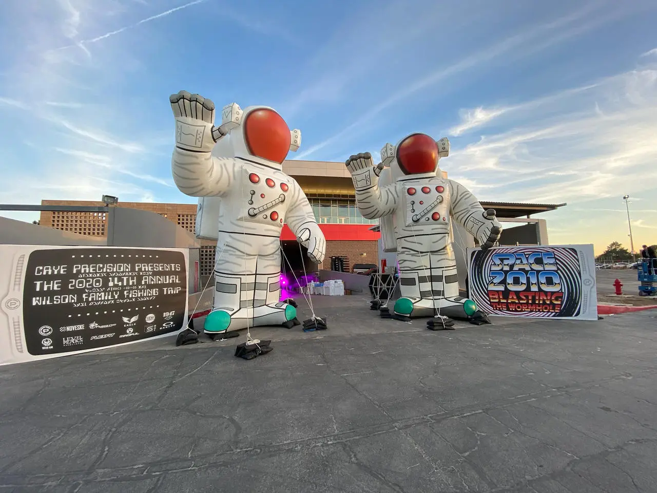 Outdoor event with inflatable astronauts and custom banners for event production in Las Vegas